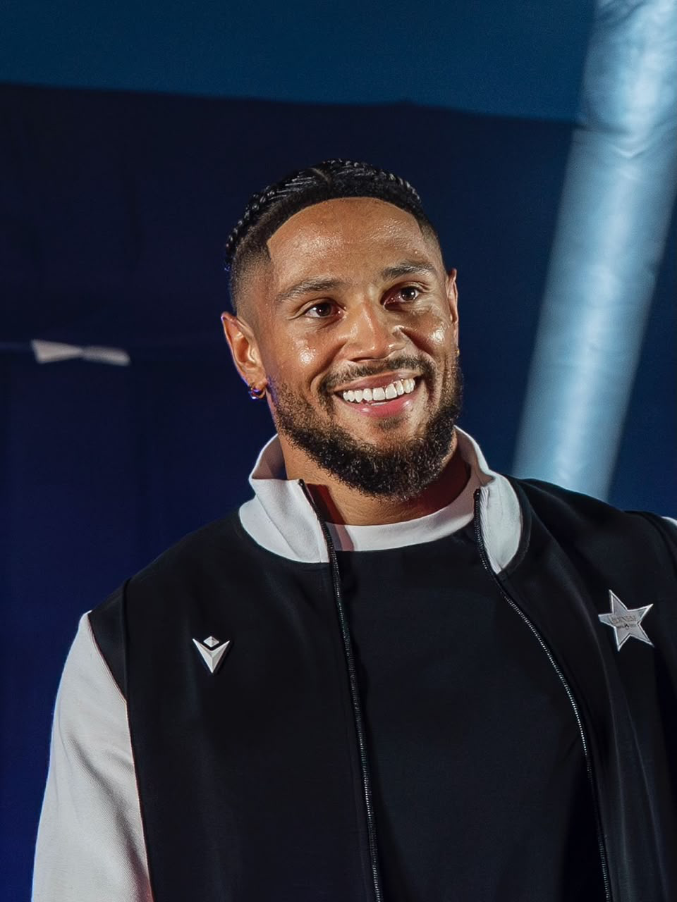 Maduka Emil Okoye smiling in team wear